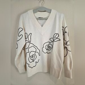 Elegant Cream Sweater with Floral Design